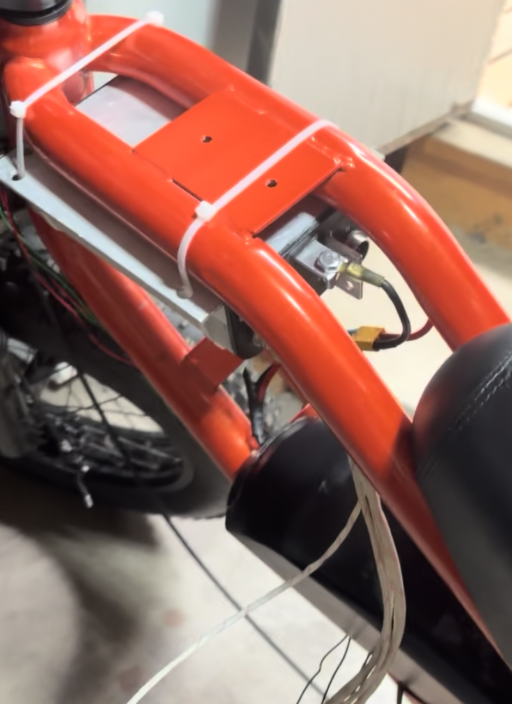 The rewired bike with battery and controller installed.