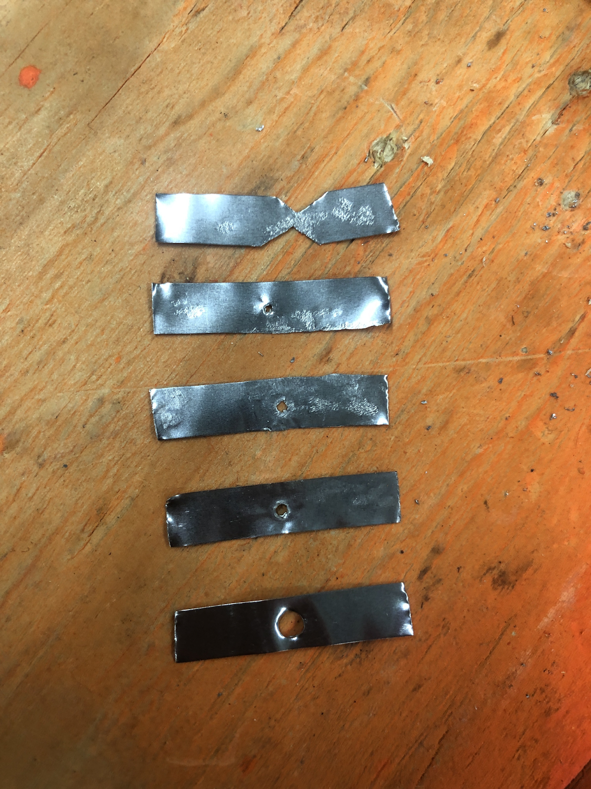 Five hand-made nickel fuse-link prototypes.