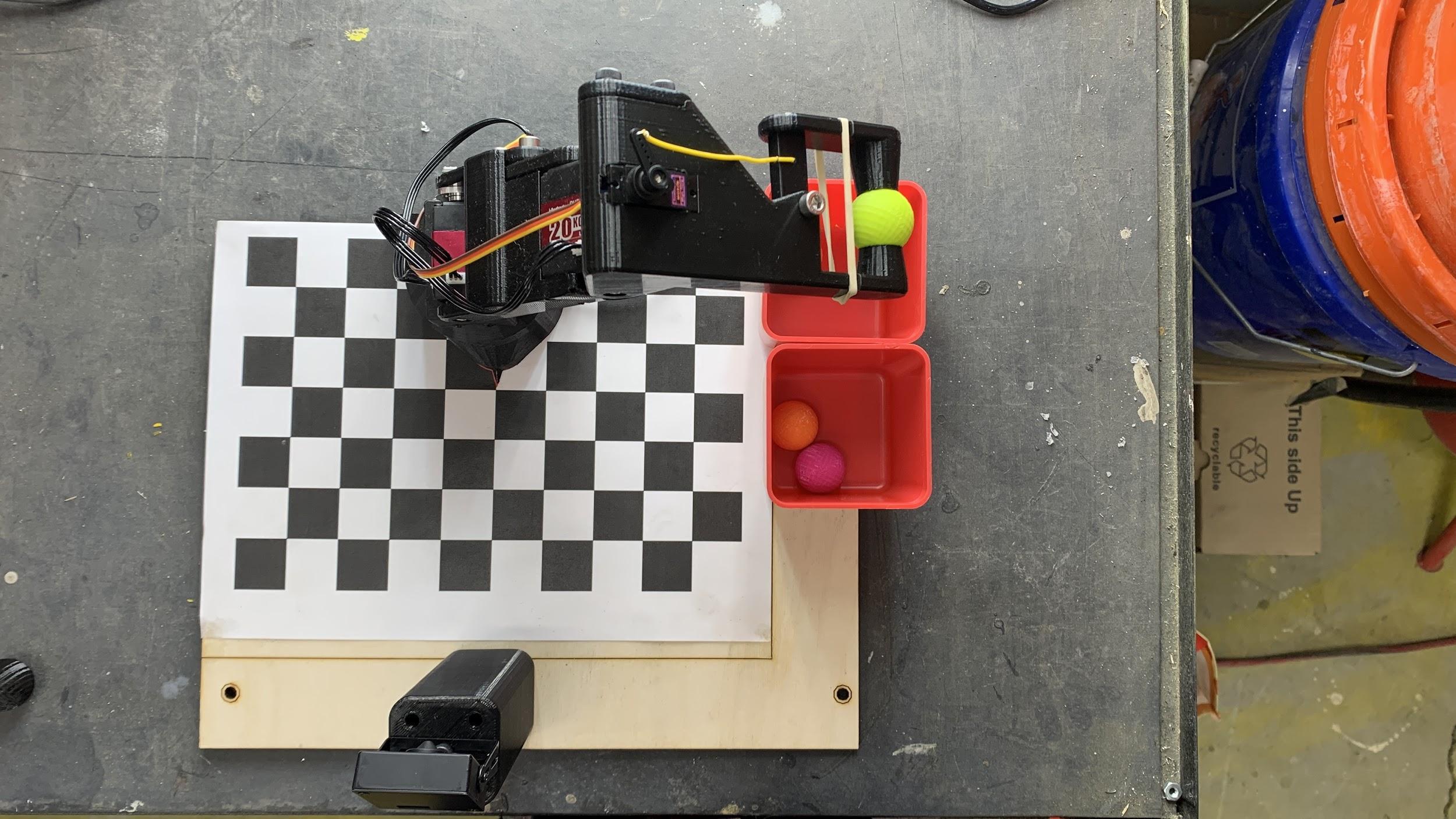 An overhead view of the checkerboard produce-sorting workspace.